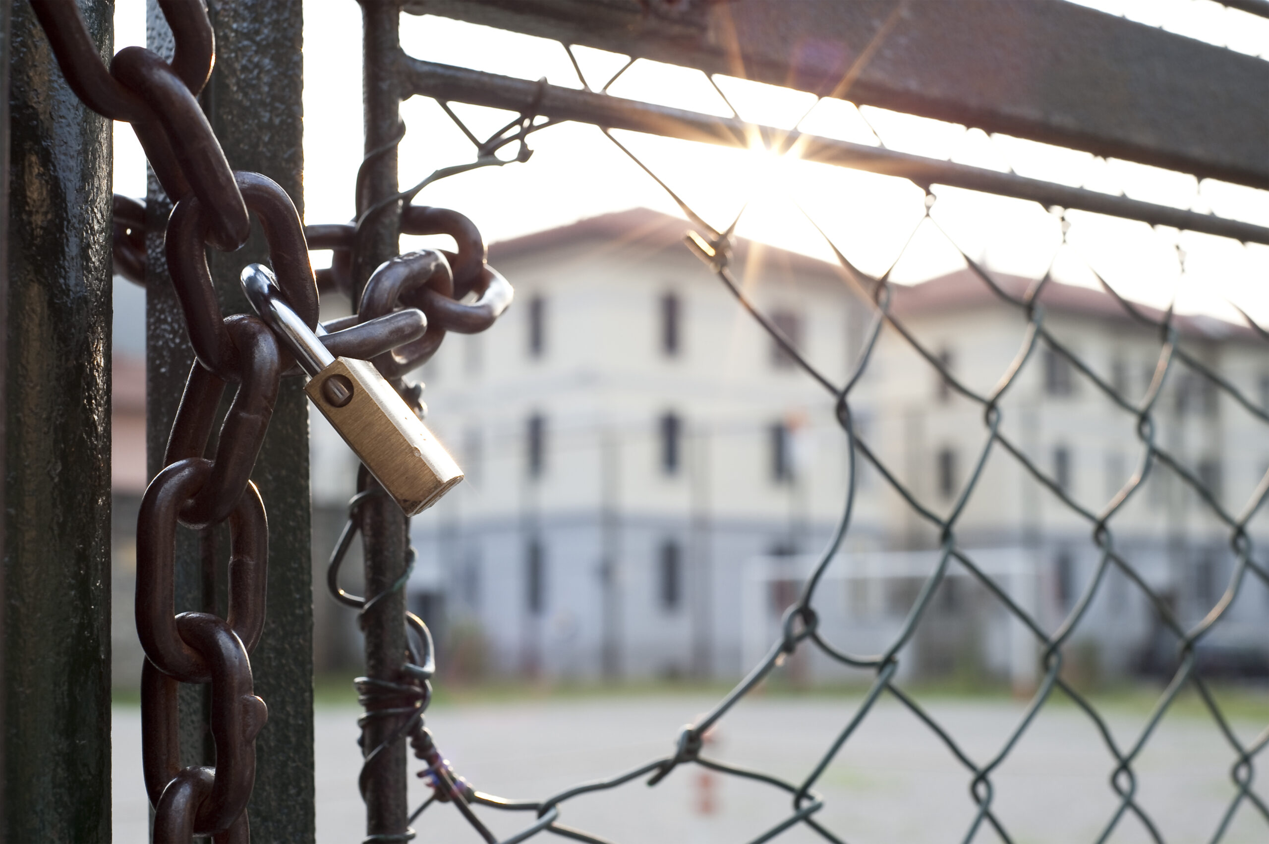 Lock And Hole In The Net Against The Light