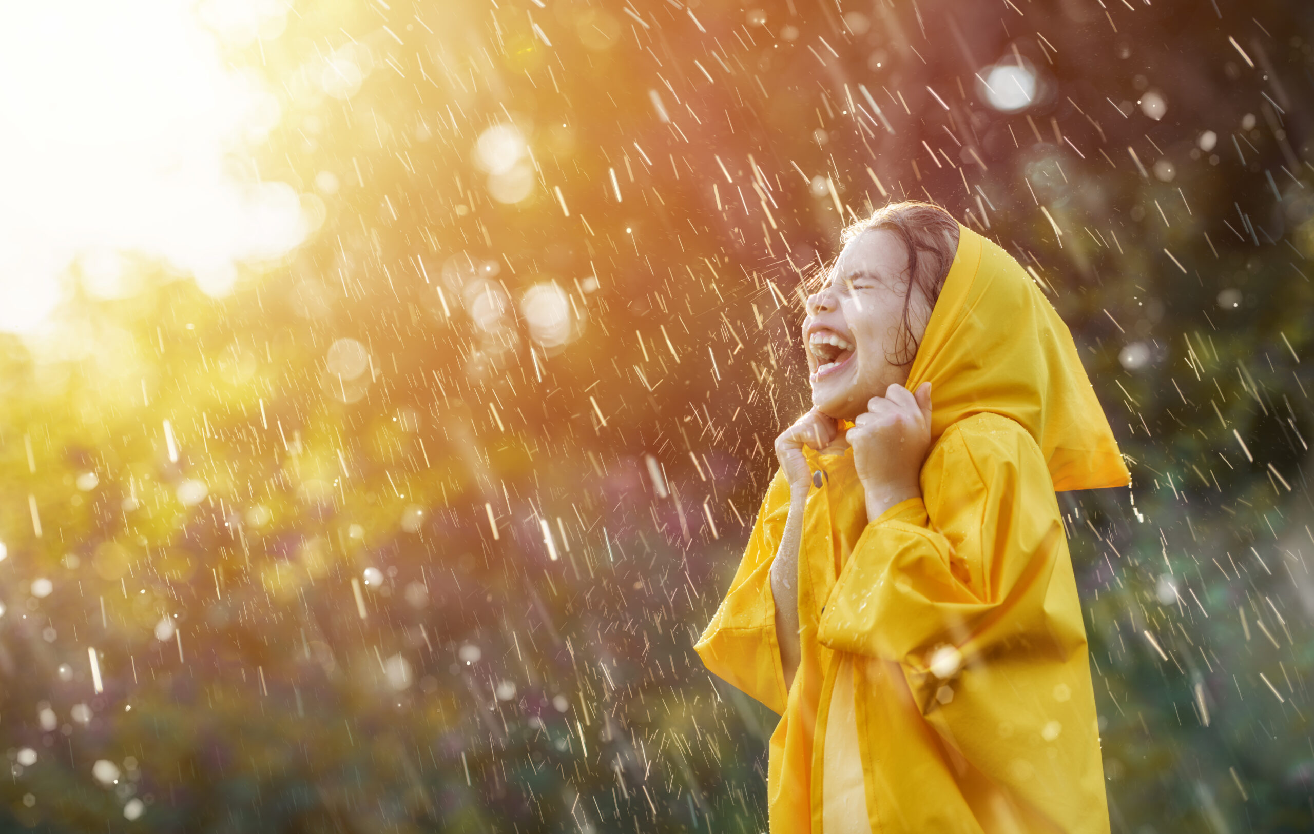 child under autumn rain